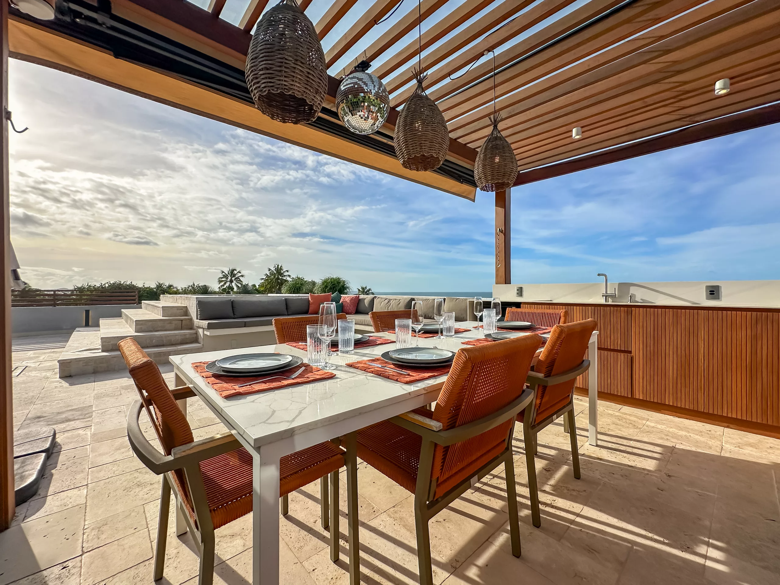 Private Vila Manga Rosa rooftop prepared for dining with ocean views
